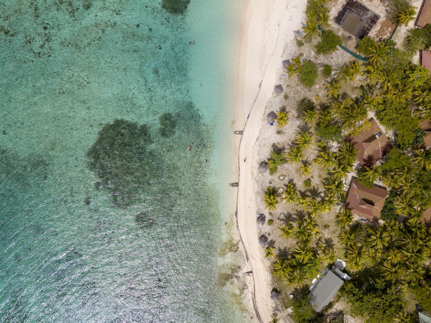 aerial view of beach and huts