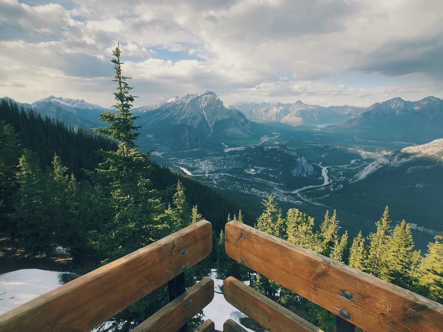 scenic view of mountains under cloudy sky