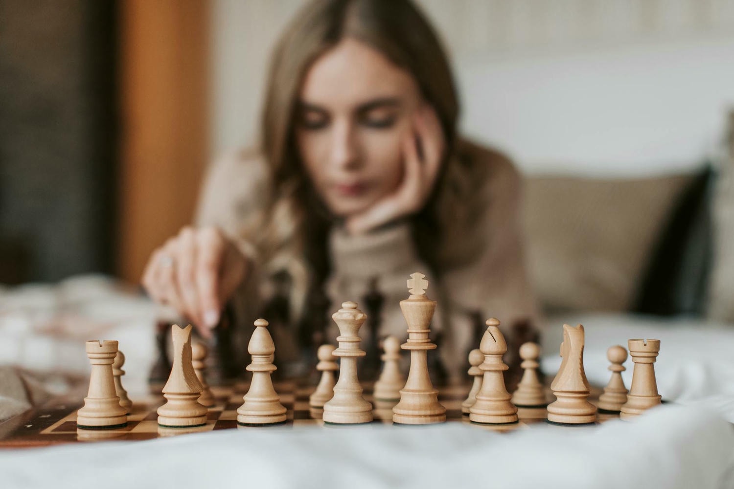 a woman playing a game of chess